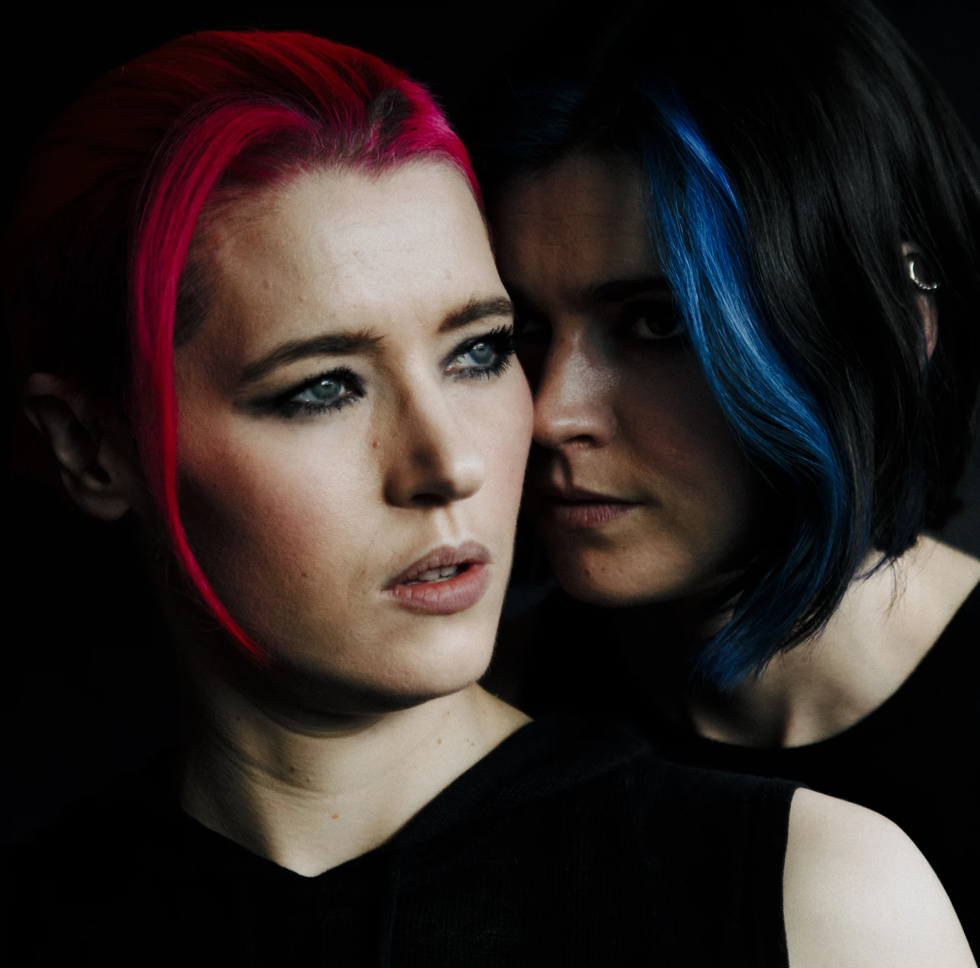 SpaceAcre, an intimate portrait lit in red and blue